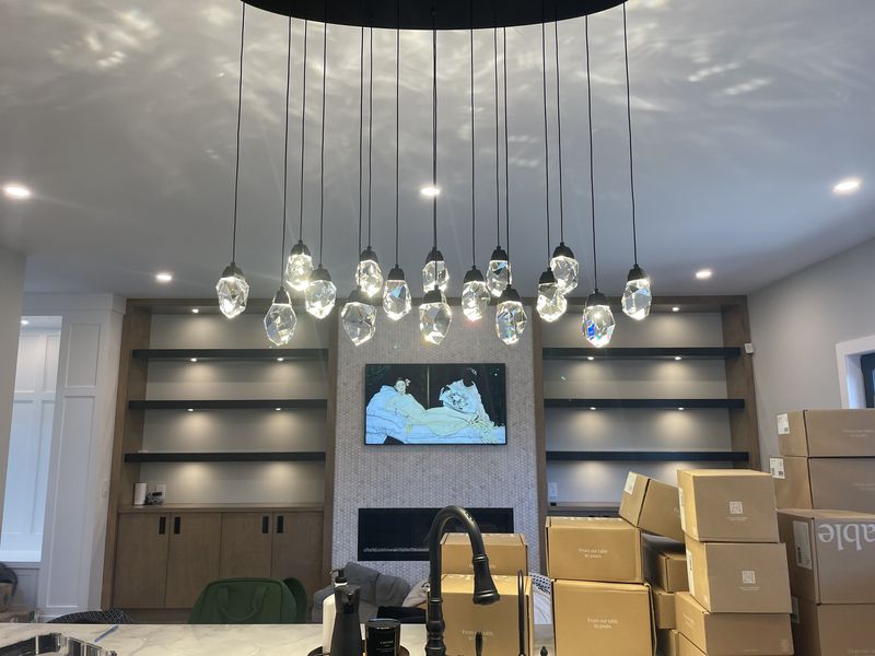 Crystal pendant chandelier over a kitchen island