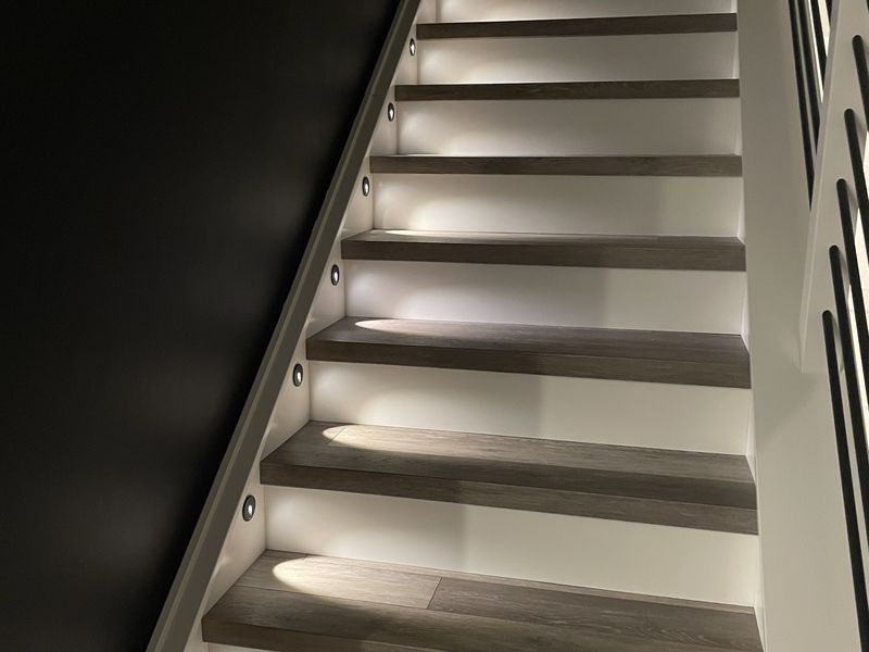 LED-lit staircase with illuminated treads