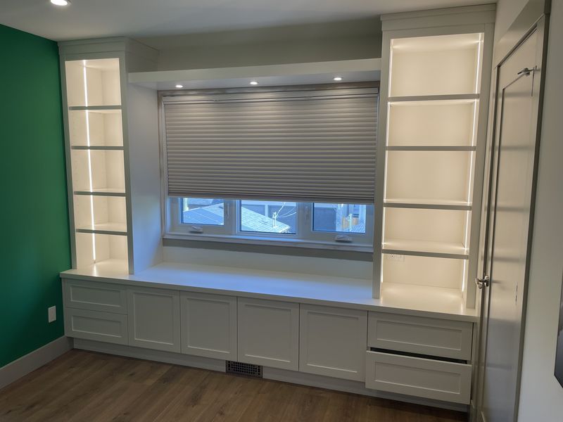 Custom window-seat built-in with LED shelving