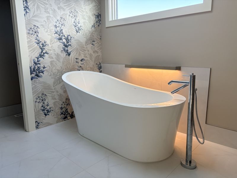 Spa bathroom with backlit accent niche
