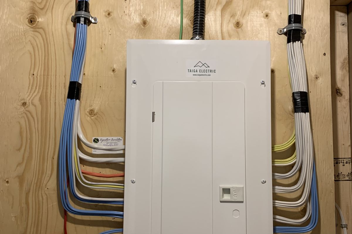 Custom electrical panel with dressed wiring by Taiga Electric